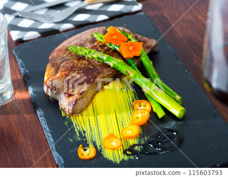 Well done beef steak with asparagus Well done beef steak with asparagus 115603793