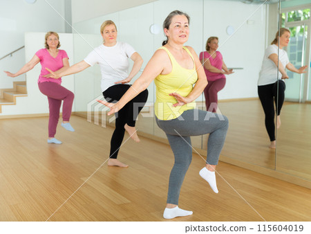 Mature women training at group dance class 115604019