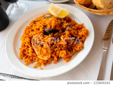 Seafood paella with lemon Seafood paella with lemon 115604281