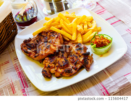 Grilled boneless chicken thighs Grilled boneless chicken thighs 115604417