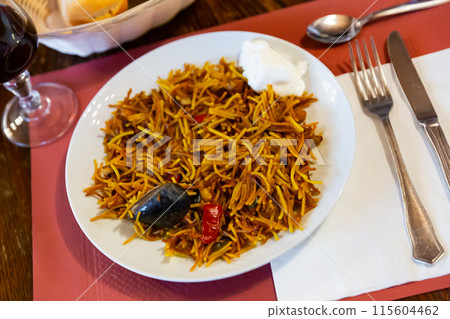 Paella with fideua, pasta noodles and seafood Paella with fideua, pasta noodles and seafood 115604462