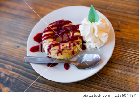 Cookie with ice-cream and berry jam served on table 115604487