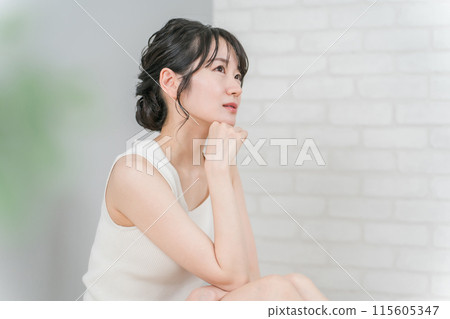 Smiling Asian woman in sleeveless clothes for beauty, skin care and diet image (worried, thinking) Smiling Asian woman in sleeveless clothes for beauty, skin care and diet image (worried, thinking) 115605347