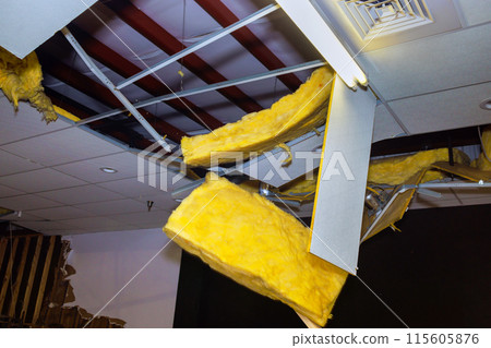 Damaged ceiling is demolition project during renovation of commercial building Damaged ceiling is demolition project during renovation of commercial building 115605876
