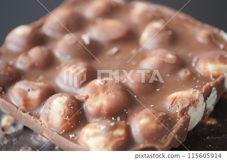 dark chocolate mixed with hazelnuts dark chocolate mixed with hazelnuts 115605914