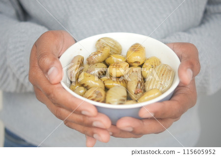 holding a bowl of Turkish Grilled olives  115605952