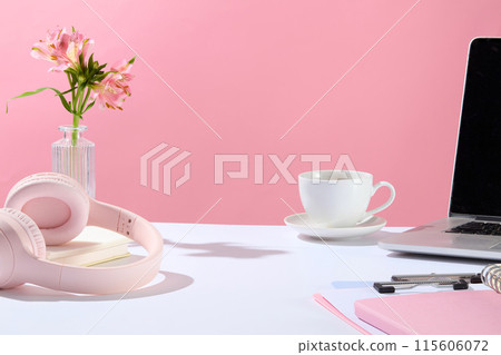 Office theme photo in pink color tone from front angle, blank space in the center of white countertop for product displaying, variety office necessities. Copy space for adding text Office theme photo in pink color tone from front angle, blank space in the center of white countertop for product displaying, variety office necessities. Copy space for adding text 115606072