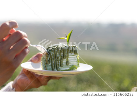 Close Up hand and cake lifestyle women eating tea cake  115606252