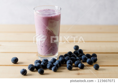 Blueberry smoothie with yogurt in a glass. Blueberry smoothie with yogurt in a glass. 115607071