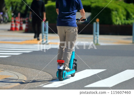 Image of an electric kickboard running on the road Image of an electric kickboard running on the road 115607460