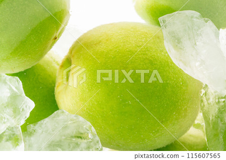 Close-up of green plums and rock sugar for homemade plum wine 115607565