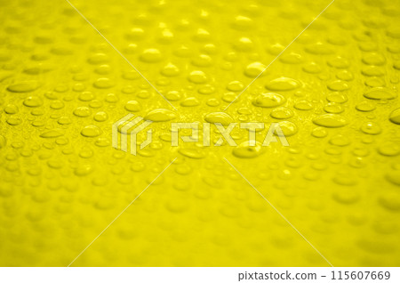 Water droplets on yellow cover background. Water droplets concept. Water droplets on yellow cover background. Water droplets concept. 115607669