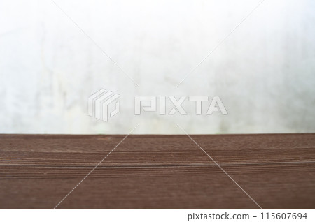 Empty wooden table in front of blurred white background with customizable space for display or montage your products Empty wooden table in front of blurred white background with customizable space for display or montage your products 115607694