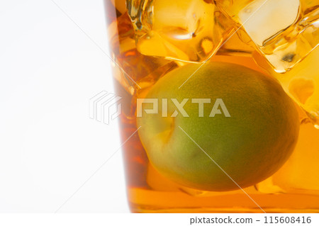Close-up of amber-colored aged plum wine Close-up of amber-colored aged plum wine 115608416