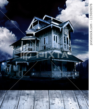 Halloween banner with haunted house and blank wooden table top. Wood terrace flooring and abandoned house in night forest. Scary colonial cottage in mysterious forestland. Photo toned in blue color Halloween banner with haunted house and blank wooden table top. Wood terrace flooring and abandoned house in night forest. Scary colonial cottage in mysterious forestland. Photo toned in blue color 115609076