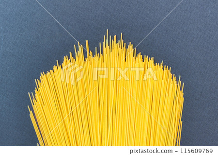 Spaghetti pasta on light blue background Spaghetti pasta on light blue background 115609769