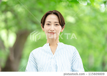 Title: Woman in the midst of fresh greenery - Beauty Title: Woman in the midst of fresh greenery - Beauty 115609809