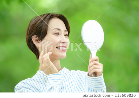 Title: Woman in the midst of fresh greenery - Beauty 115609820