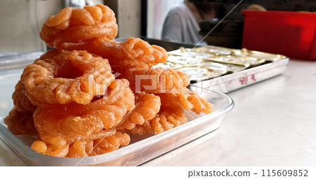 Indian Sweet Imarti at Shop, A circular shaped dessert 115609852