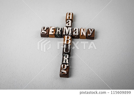 GERMANY HAMBURG. Alphabet blocks, crossword puzzle on gray textured background GERMANY HAMBURG. Alphabet blocks, crossword puzzle on gray textured background 115609899