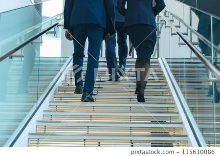 Group of business people walking up the stairs Group of business people walking up the stairs 115610086