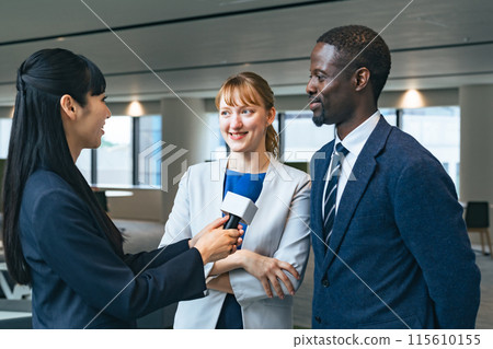 Foreign couple being interviewed Foreign couple being interviewed 115610155