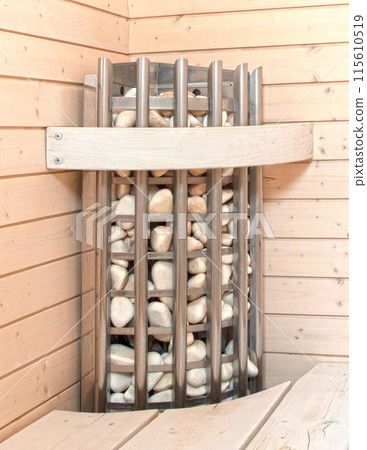 Lava stones on the sauna stove Lava stones on the sauna stove 115610519