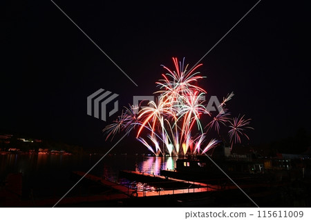 Beautiful colorful fireworks with reflections in water. Brno dam, the city of Brno-Europe. International Fireworks Competition. Beautiful colorful fireworks with reflections in water. Brno dam, the city of Brno-Europe. International Fireworks Competition. 115611009