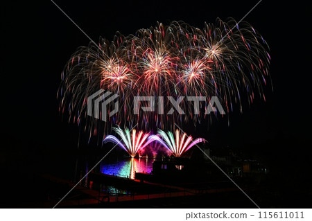 Beautiful colorful fireworks with reflections in water. Brno dam, the city of Brno-Europe. International Fireworks Competition. 115611011