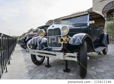 An old American convertible black retro car from the beginning of the 20th century An old American convertible black retro car from the beginning of the 20th century 115611146