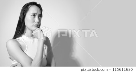 Worried, depressed woman image, monochrome Worried, depressed woman image, monochrome 115611680
