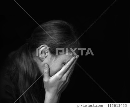 Sad womanon dark background Sad womanon dark background 115613433