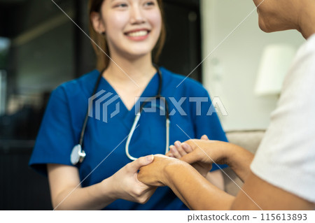Female doctors shake hands with patients encouraging each other  To offer love, concern, and encouragement while checking the patient's health. concept of medicine. Female doctors shake hands with patients encouraging each other  To offer love, concern, and encouragement while checking the patient's health. concept of medicine. 115613893