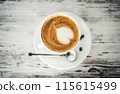 Cup with cappuccino, latte on table. 115615499
