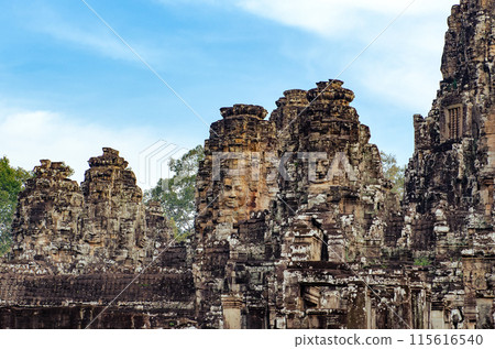 The bayon temple smiling stone faces showing on a sunny day in angkor thom, siem reap, cambodia 115616540