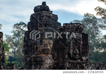 The bayon temple smiling stone faces showing on a sunny day in angkor thom, siem reap, cambodia 115616543