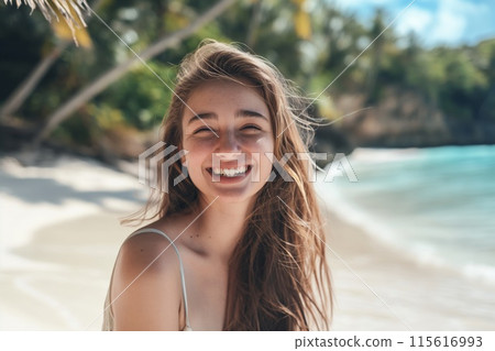 Radiant young woman with a beaming smile on a sunny beach backdrop 115616993