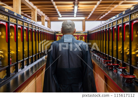 A monk praying in the memorial hall A monk praying in the memorial hall 115617112