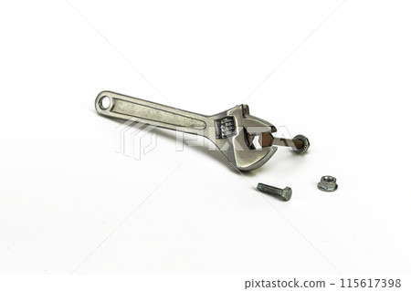 Adjustable wrench with bolt and nut on white background Adjustable wrench with bolt and nut on white background 115617398
