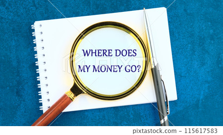 Where does all money go text through a magnifying glass on a piece of notepad Where does all money go text through a magnifying glass on a piece of notepad 115617583