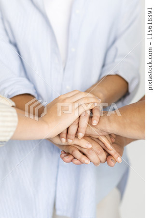 European senior woman, teen girl and adult mom put hands on hands, isolated on white studio background. Female generation, power together, love, relationship, team and family support European senior woman, teen girl and adult mom put hands on hands, isolated on white studio background. Female generation, power together, love, relationship, team and family support 115618391