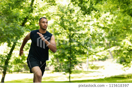 Serious attractive millennial african american man athlete sprinter training, running at summer park. Workout, sports outdoor, cardio exercises, prepare to competition and lifestyle 115618397