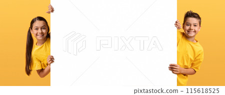 Great offer for children. Preteen kids boy and girl with white blank horizontal advertising placard posing on yellow background, web-banner. Brother and sister with empty placard Great offer for children. Preteen kids boy and girl with white blank horizontal advertising placard posing on yellow background, web-banner. Brother and sister with empty placard 115618525