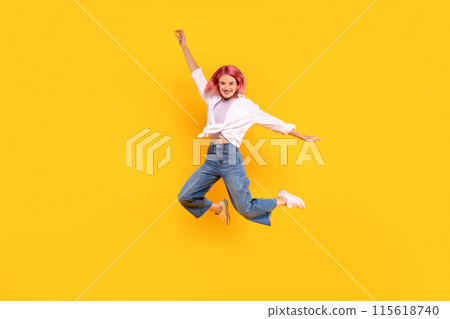 Glad lady student in casual with pink hair jumping and freezing in air, having fun isolated on yellow background, studio, full length. Lifestyle, education, huge sale, ad and offer 115618740