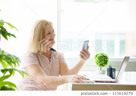 Woman with computer. Working female at laptop 115619270