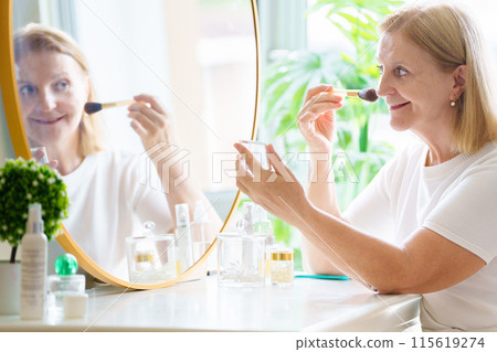 Skin care for senior woman. Anti-aging cream. 115619274