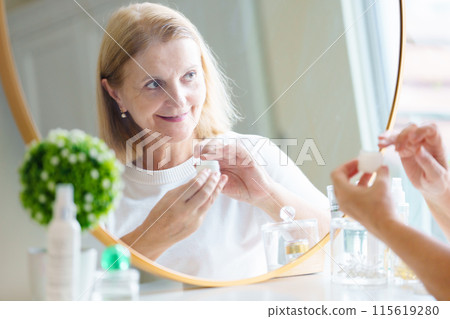 Skin care for senior woman. Anti-aging cream. Skin care for senior woman. Anti-aging cream. 115619280