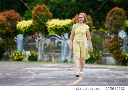 Senior woman with mobile phone on city street Senior woman with mobile phone on city street 115619282