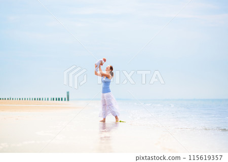 Mother and child on beach. Vacation with baby. Mother and child on beach. Vacation with baby. 115619357