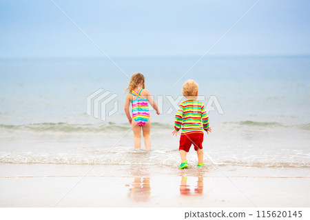 Kids playing on beach. Children play at sea. 115620145